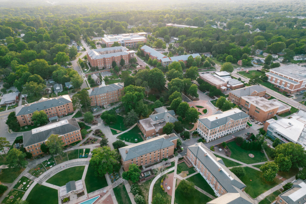 University campus aerial photo shows various buildings and grounds.