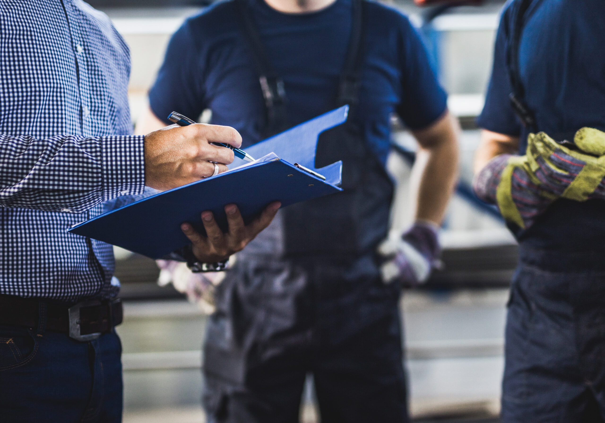 maintenance workers discussing a work order